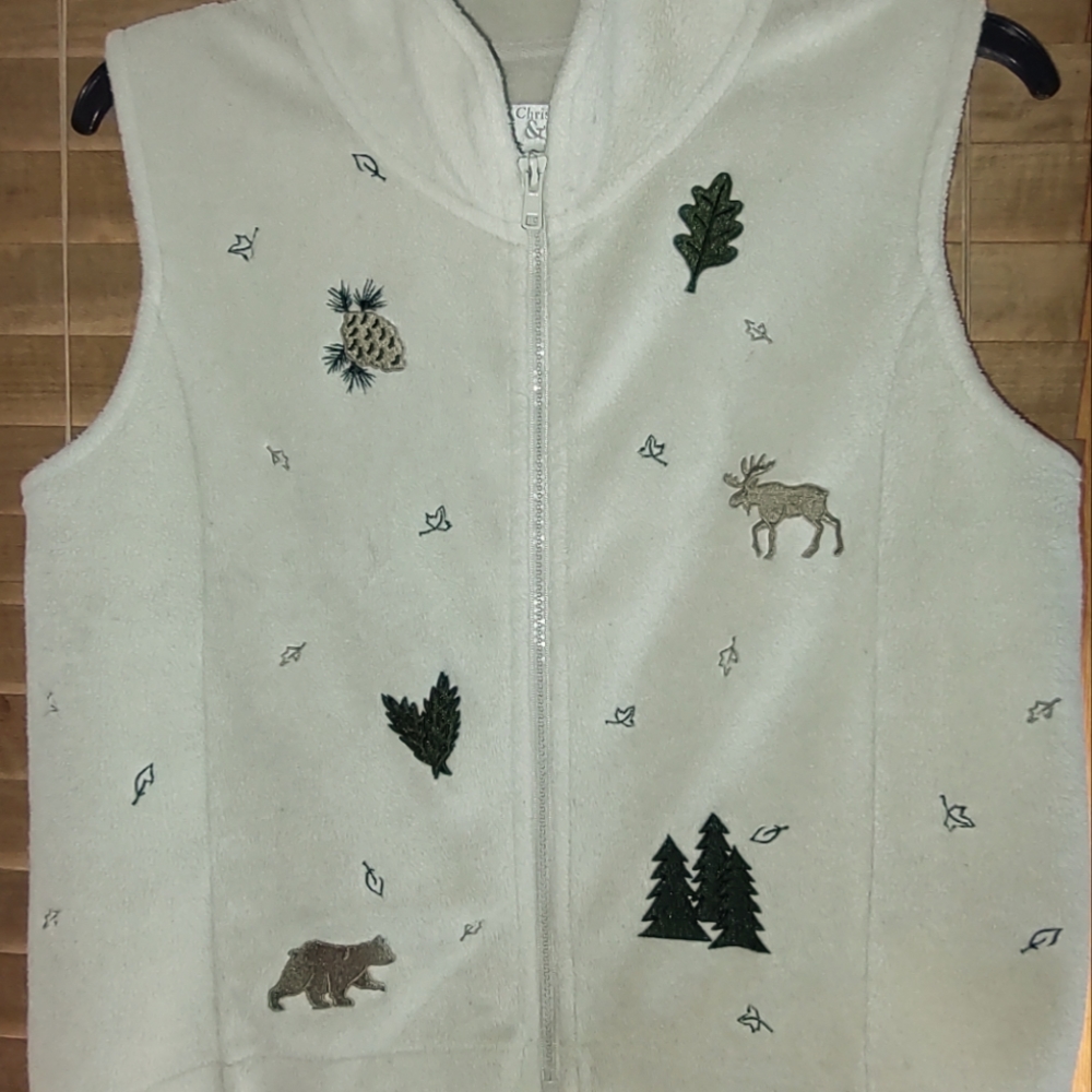 Fleece vest with sewn on appliques. Christopher Banks size small.
